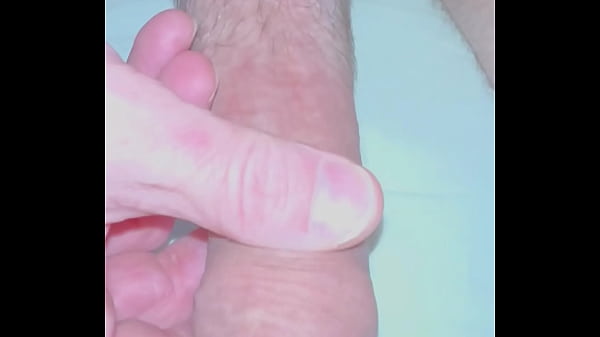 Gay guy pulling back foreskin