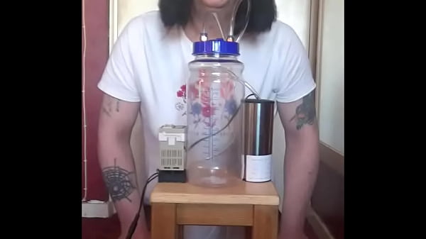 bisexual crossdresser with his portable cow milking machine