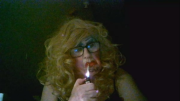 Disgusting mature tranny milf, Sarah Millward, smokes, wanks her clit, and fucks her arsehole cunt with 9 inch bbc dildo
