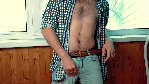 Handsome guy with a perfect body jerks off on the balcony and tries to cum very quickly