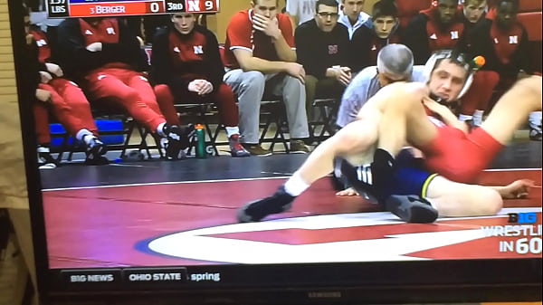 Blue wrestler shoves his cock on red wrestler’s ass
