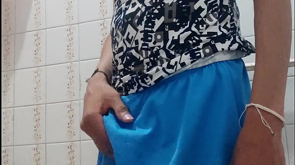 Man with a big cock masturbates in a bathroom