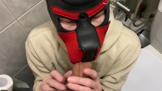 Young guy sucks big dick in public toilet and gets cumshot