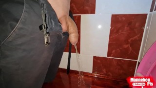 Boy long pissing in a village toilet