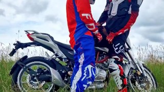 Hot motocross boys cum near motorcycle