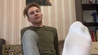 Hot twink shows his black snickers with socks and feet